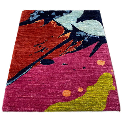 Gabbeh rug 89x60 cm, abstract pattern on a pink-red base with yellow and blue tones
