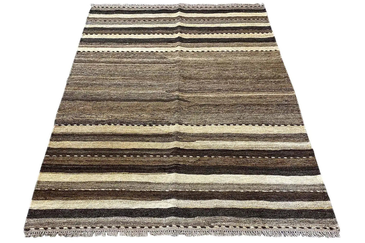 Draped rug with stripes in gray, beige and dark brown, fringes.