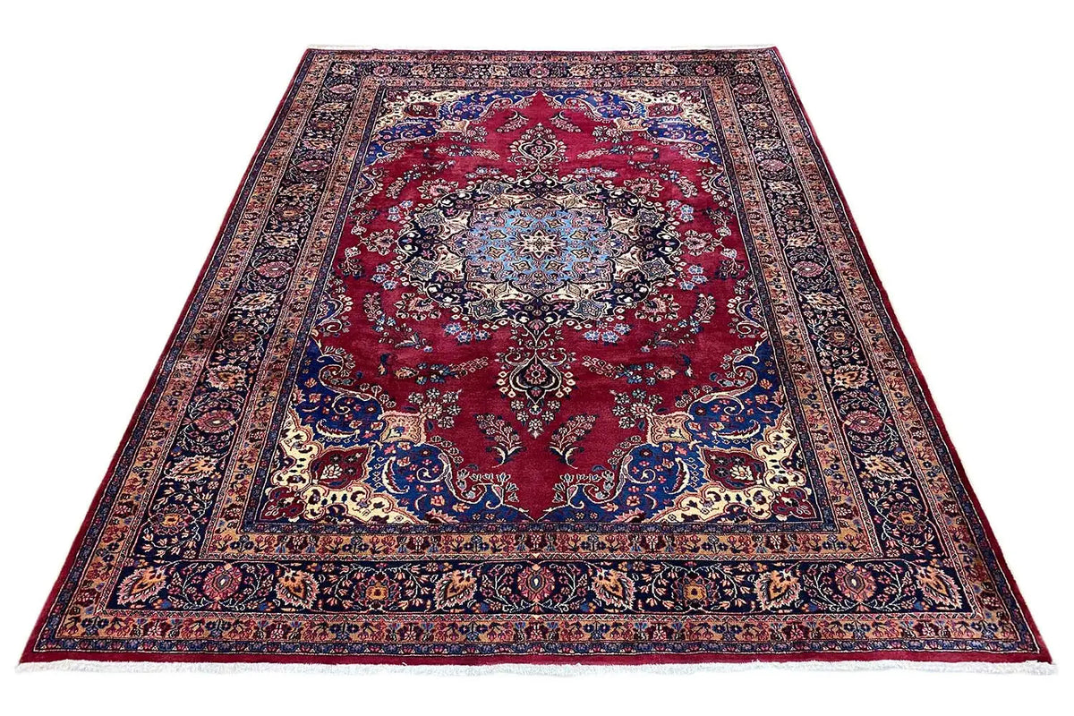 Rug with a red central medallion, blue border, and ornamental pattern