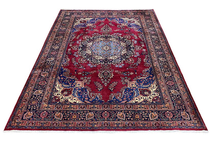 Rug with a red central medallion, blue border, and ornamental pattern