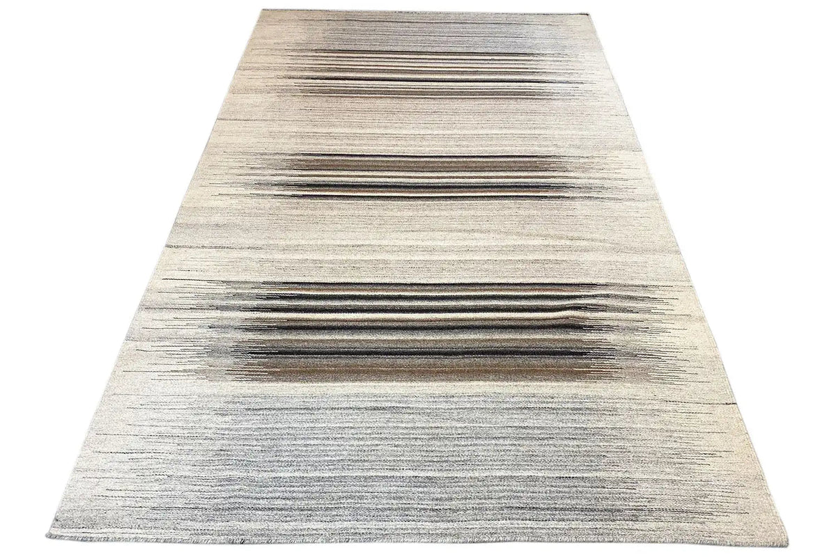 Dhurrie rug, triangular view: wide lines in gray and brown on light beige