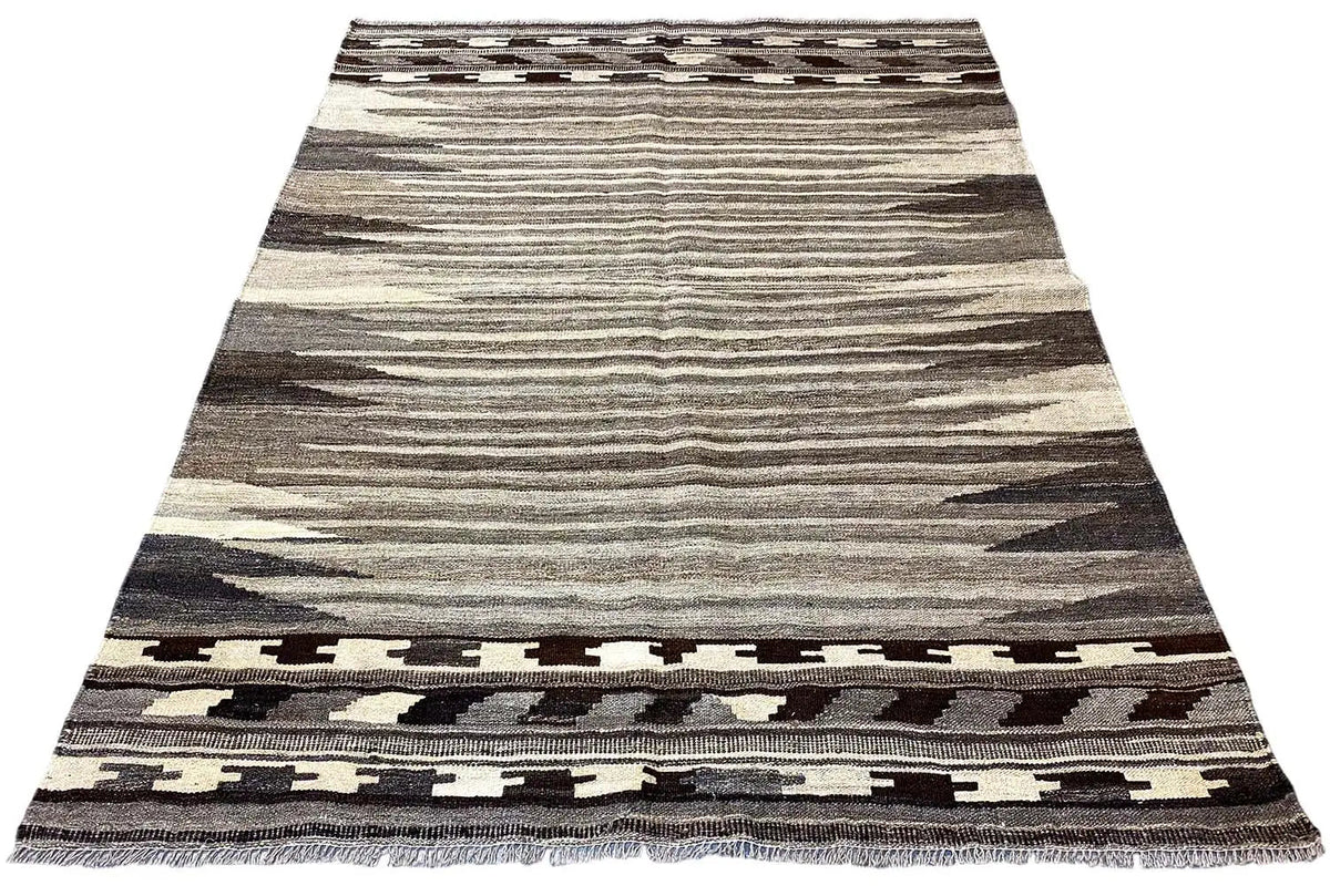 Kilim rug with a wide central stripe and a dark border at the bottom
