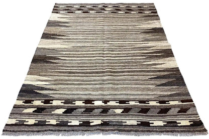 Kilim rug with a wide central stripe and a dark border at the bottom