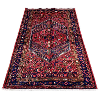 Red Hamadan rug with a dark border and central medallion ornament