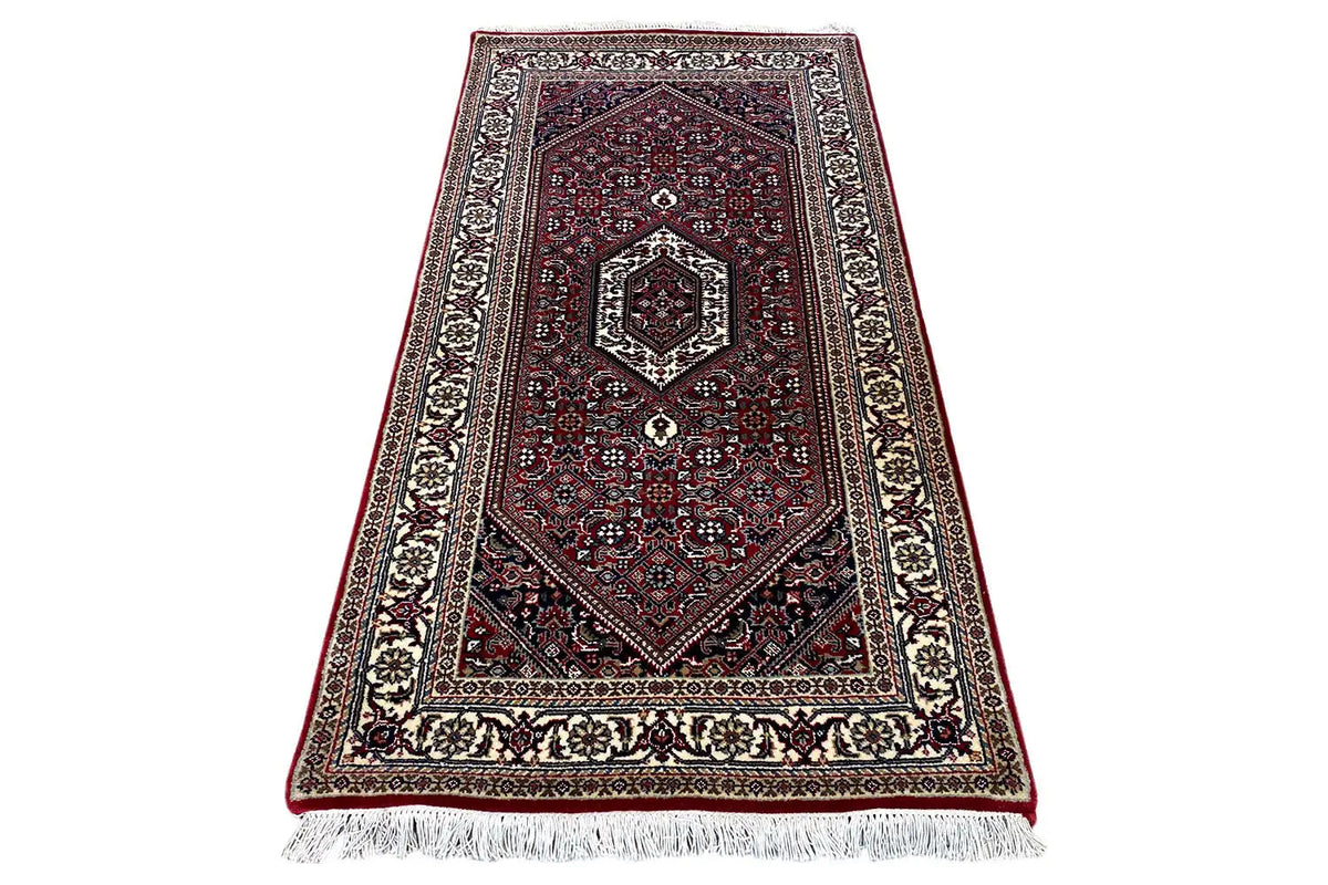 Bidjar rug in dark red with central medallion, diagonal view