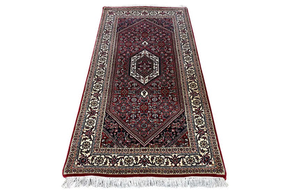 Bidjar rug in dark red with central medallion, diagonal view