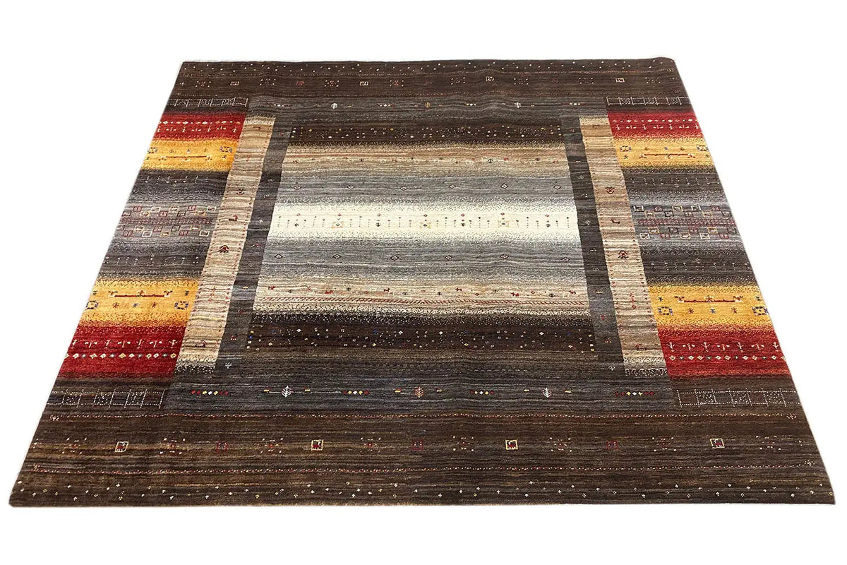 Brown Gabbeh rug with broad central stripes, border, and red Farde elements.