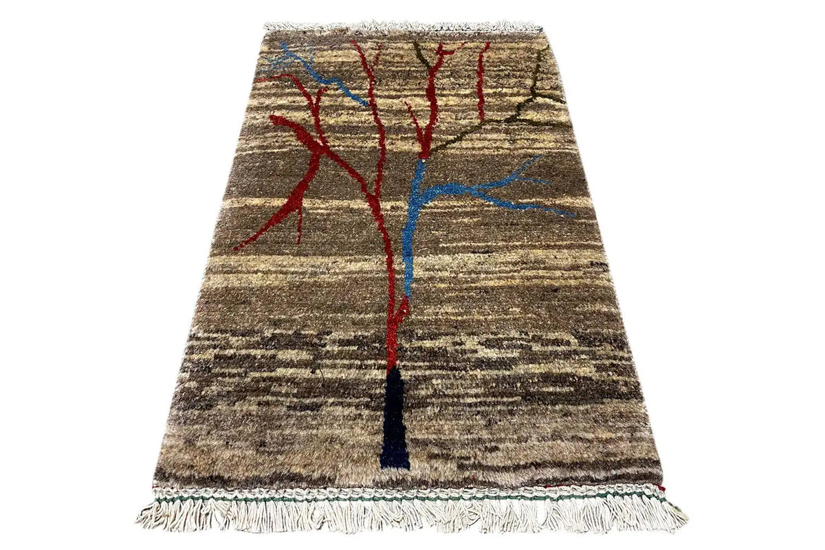 Rug with a centered red-and-blue tree ornament, brown-and-beige striped pattern, and fringes