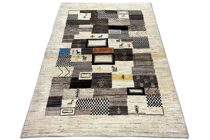 Gabbeh rug with a patchwork of light, black, and gray squares