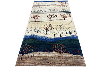 Gabbeh rug with tree motifs, a white-cream surface and a dark central stripe