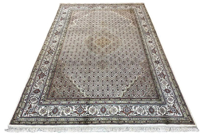 Indo Tabriz rug with ornaments, gray-beige background and fringes along the edges, 293x201 cm.