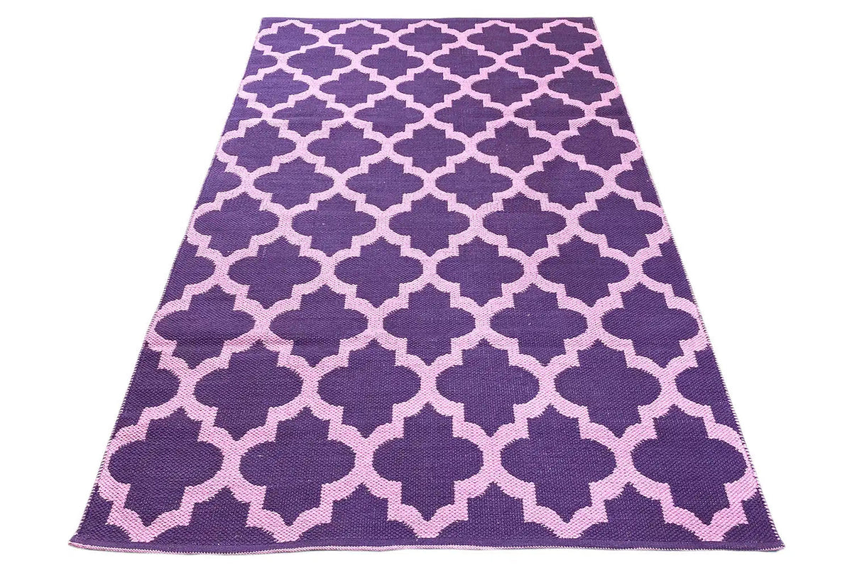 Kilim folded into a triangular shape, purple mosaic pattern with light interstitial shapes
