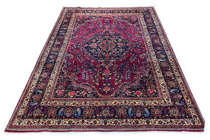 Rug with a rectangular pattern, red background, and blue borders