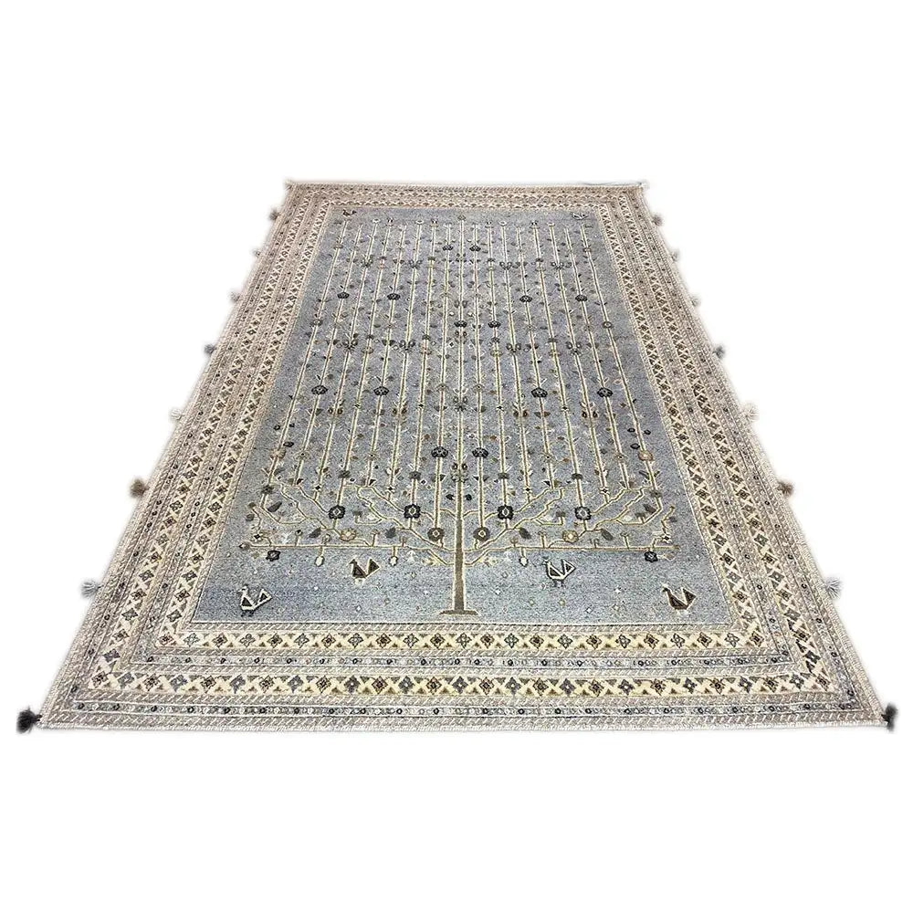 Rug with a blue-gray center, golden-beige ornaments and a bordered edge, tassels