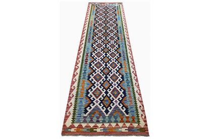 Kilim runner spread diagonally with geometric ornaments and a colorful border