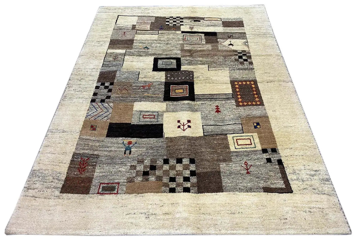 Rug with a beige border and an abstract patchwork pattern in gray, brown, and black