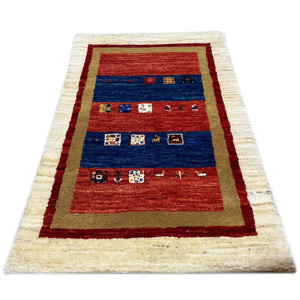 Gabbeh rug with red and blue medallion band and cream-colored border, 93x59 cm
