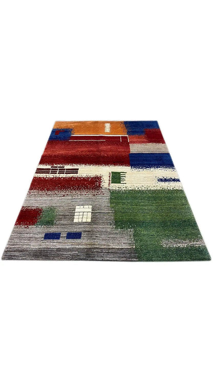Gabbeh rug (198x150 cm) laid flat, geometric blocks in green and red
