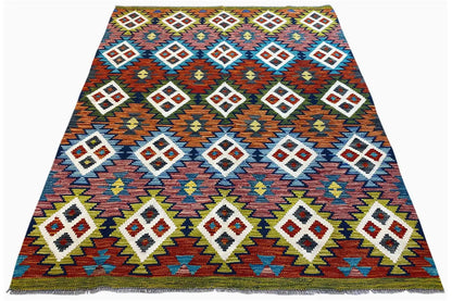 Kilim Afghan rug, draped into a triangle, with geometric diamonds in multiple colors