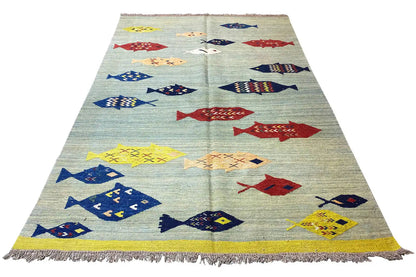 Kilim, multicolored with fish motifs; rectangular, fringes all around