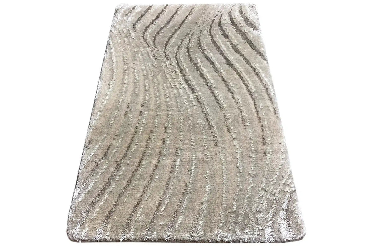Light gray trapezoid-shaped rug with a wavy pattern and short pile