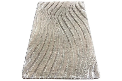 Light gray trapezoid-shaped rug with a wavy pattern and short pile