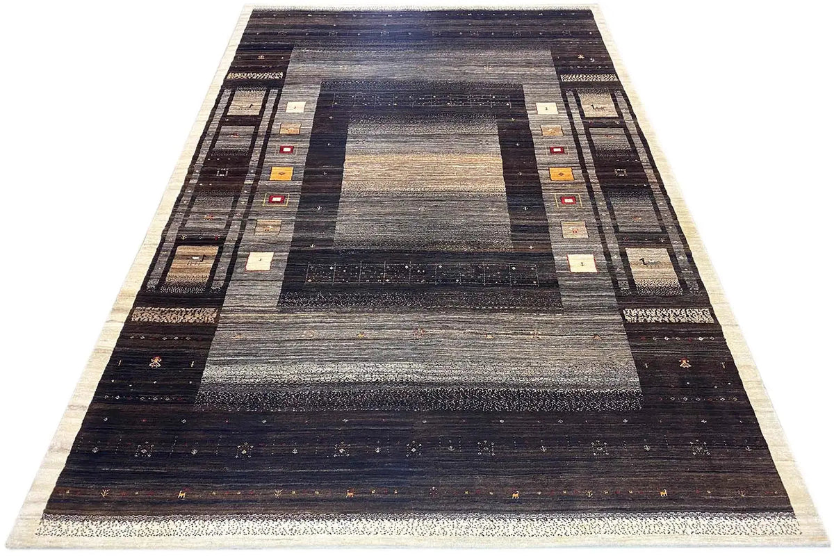 Gabbeh rug in dark brown and gray with geometric borders and central field