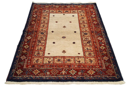 Rug with a rectangular base pattern, light beige center, and red-and-blue border