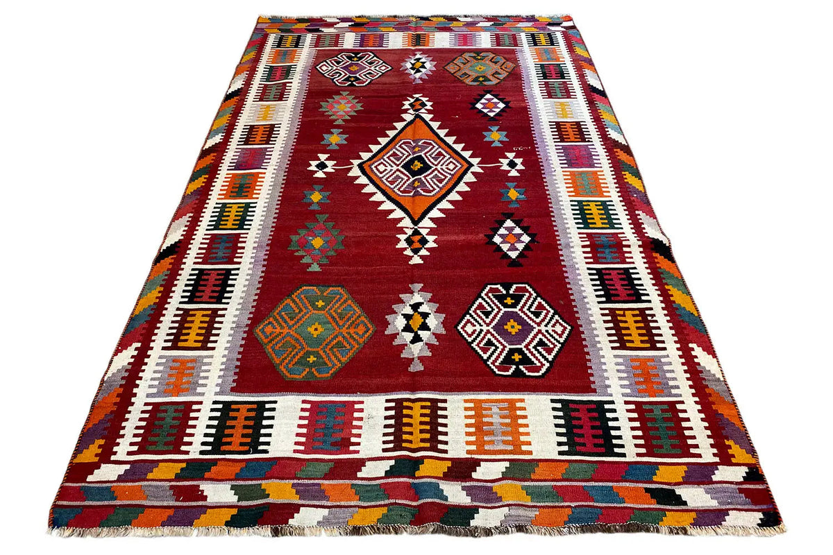 Kilim Qashqai rug, reddish brown with a central diamond motif and multicolored stripes