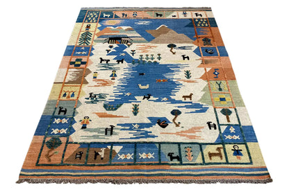 Kilim rug with an all-around border pattern and a central motif in blue, beige, and rust orange