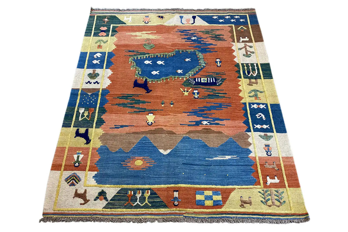 Kilim rug with a central landscape motif in blue, rust red and beige, fringes