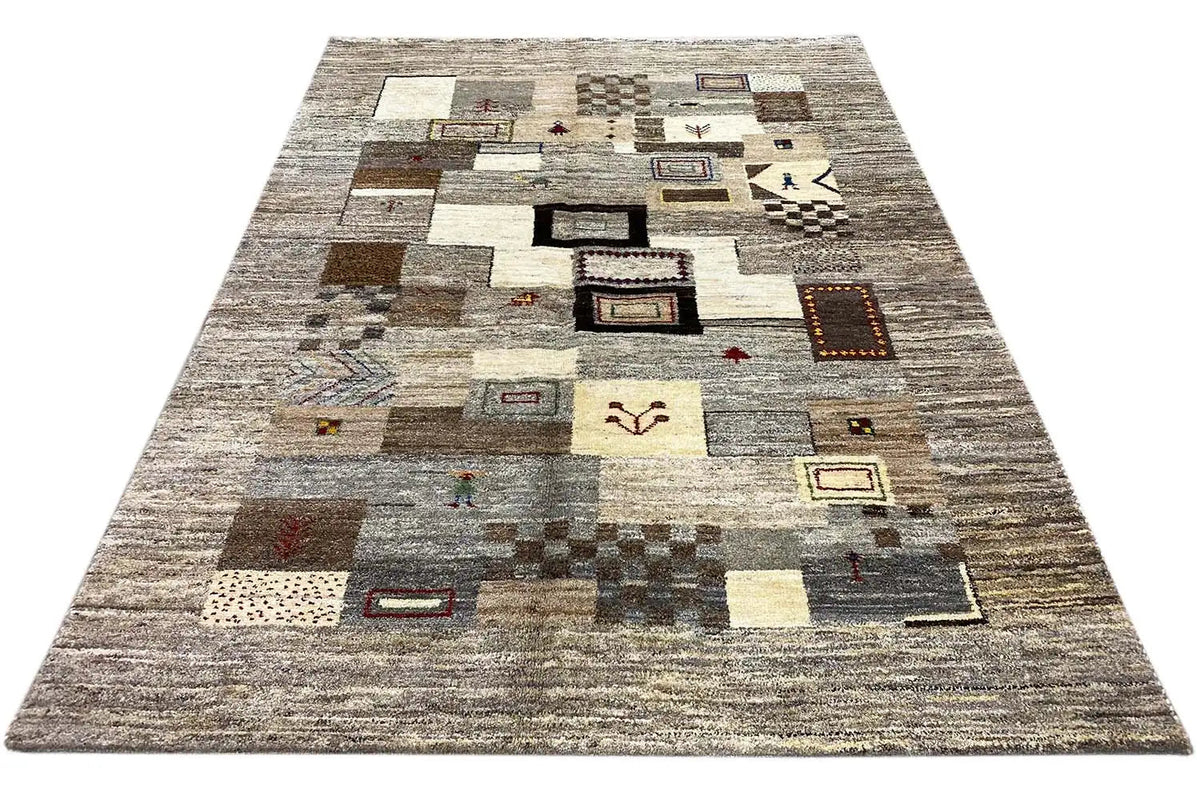 Gabbeh rug 206x155 cm, diagonal view with patchwork motifs in gray and beige