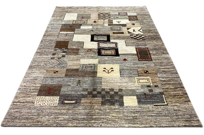 Gabbeh rug 206x155 cm, diagonal view with patchwork motifs in gray and beige