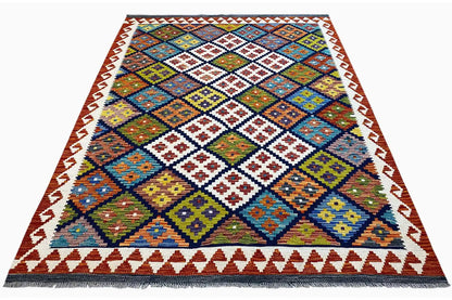 Afghan kilim with a geometric patchwork pattern, colorful border, and fringes