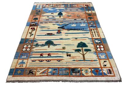 Beige Qashqai kilim rug with a blue border, landscape motifs, and fringes