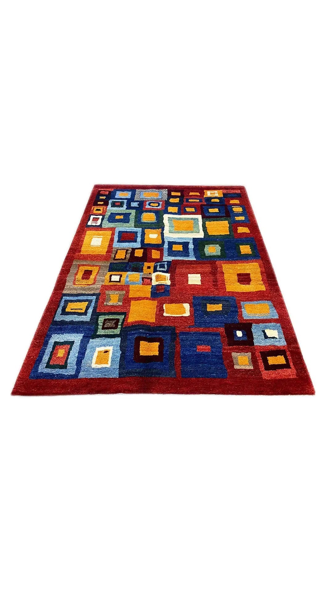Gabbeh rug (200x151 cm) with square color blocks in blue, red, yellow, and white.