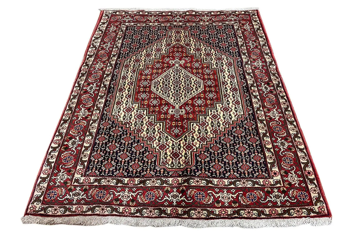 Hamadan rug in a square format with a red medallion and striped border