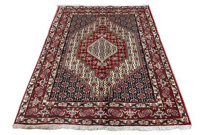 Hamadan rug in a square format with a red medallion and striped border