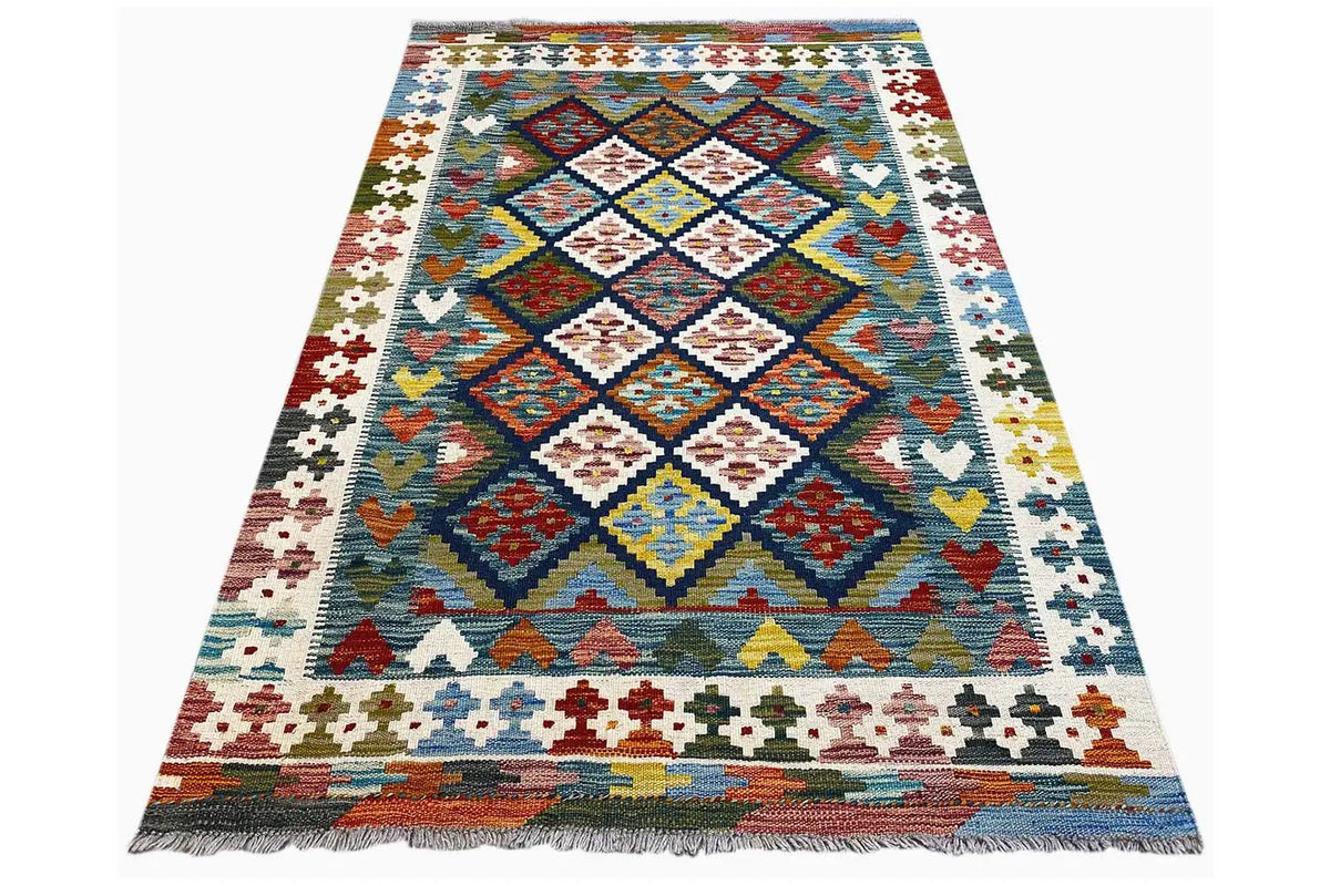 Kilim rug (160x101 cm) photographed diagonally, with a central diamond panel and border ornaments