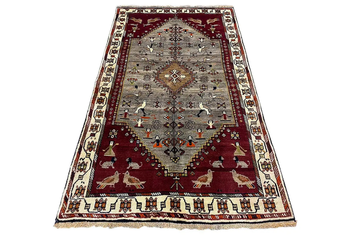 Flat-weave Gabbeh rug, red and gray with a central medallion, corner borders, and ornaments