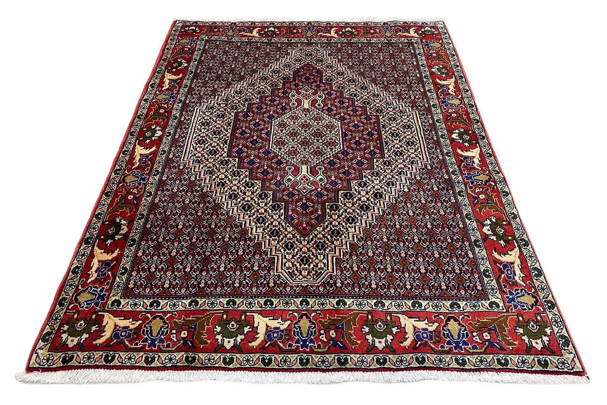Rug with a rectangular pattern and decorative border, dark red with blue-green accents