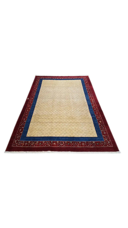Oriental rug with a light central area, red border and blue outline