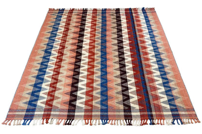 Large rug with zigzag stripes in terracotta, blue and black, fringes
