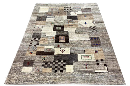 Gabbeh rug: Overall view with an all-over pattern of quadrilaterals, lines, and small accents.