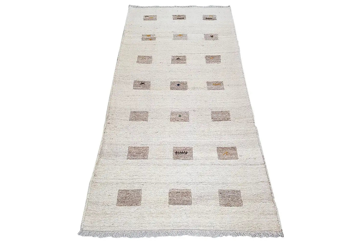 Beige kilim runner with geometric brown squares and an even fringe finish