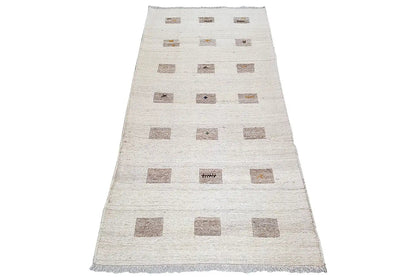 Beige kilim runner with geometric brown squares and an even fringe finish