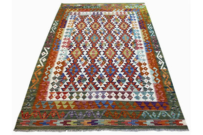 Kilim rug with an ethnic diamond and zigzag pattern in brown, blue, and cream