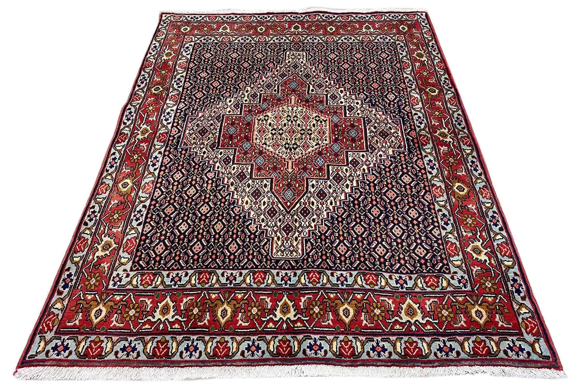 Carpet with red border and centered medallion, geometric pattern