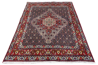 Carpet with red border and centered medallion, geometric pattern