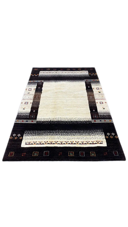 Rectangular Gabbeh rug: dark border with colorful symbols and cream-colored center